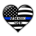 Heart-shaped police metal sign with an American flag design and blue line accent