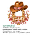 Decorative cowgirl metal sign shown with a cowboy hat, floral horseshoe design, and product feature callouts