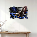 Patriotic law enforcement metal sign displayed on a light wood wall above a console table