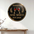 Round wine metal sign displayed on a white paneled wall above a console table in a bright home