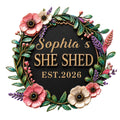 Floral wreath She Shed metal sign with colorful flowers, leafy greenery, and a dark center