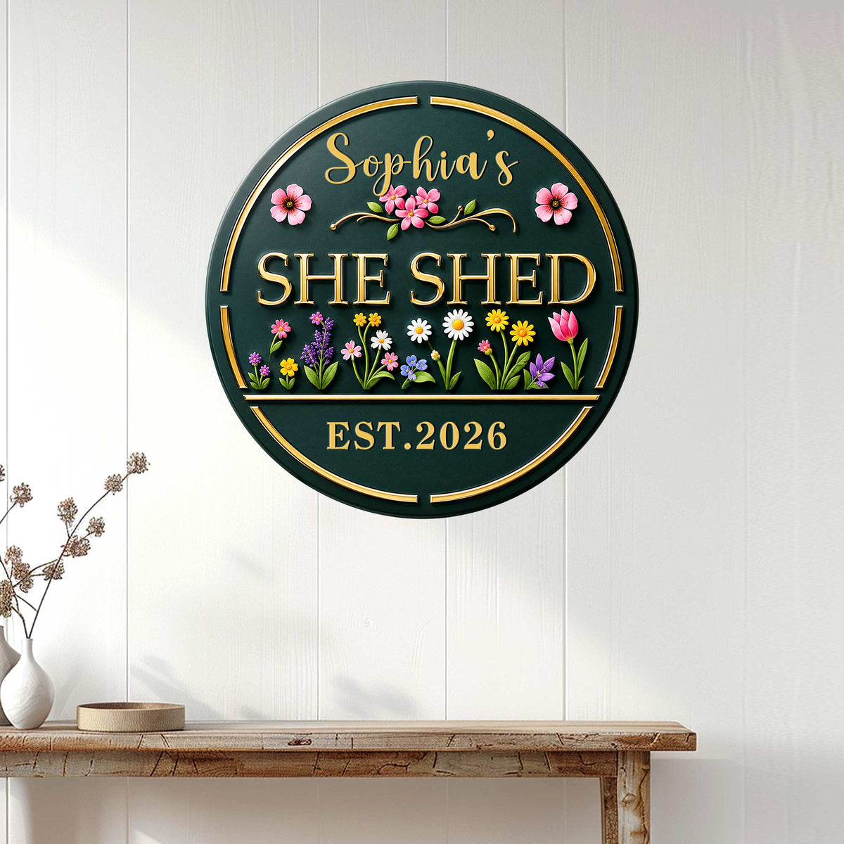 Floral She Shed metal sign displayed on a white paneled wall above a rustic console table