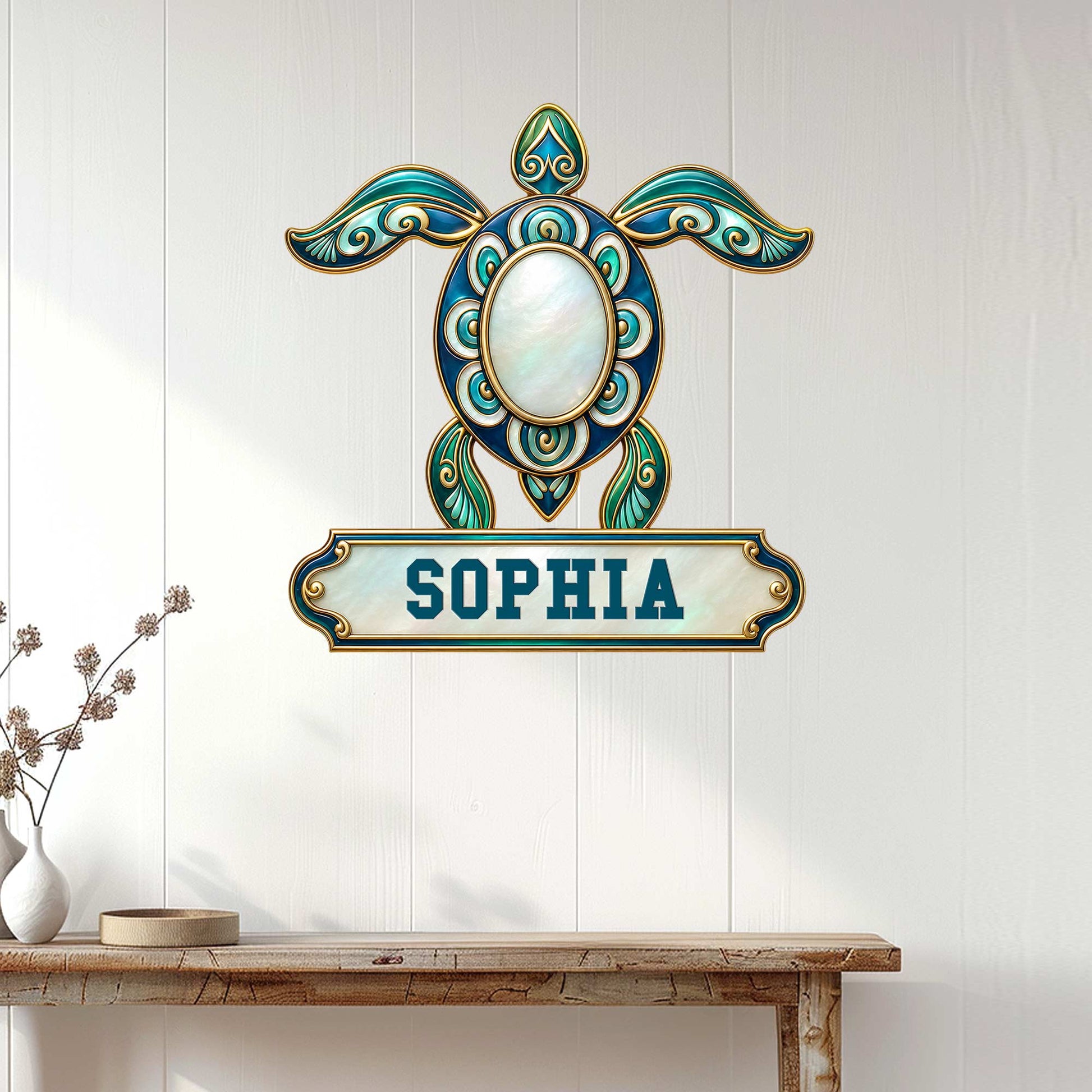 Ornate turquoise turtle wall sign displayed on a white paneled entryway above a wood console