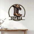Western cowgirl boot sign displayed on a white paneled wall above a rustic console table