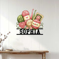 Crochet wall decor displayed on a light wood-paneled wall above a console table