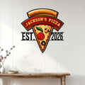 Pizza shop metal sign displayed on a white paneled wall above a rustic console table