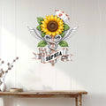 Nurse metal wall decor displayed on a light wood wall above a console table in a bright home interior