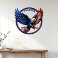Patriotic eagle metal wall sign displayed above a console table in a bright home