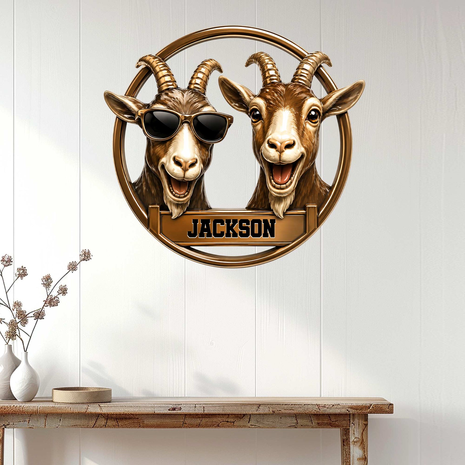 Goat wall decor displayed above a console table, featuring two expressive goats in a circular metal sign design