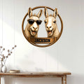 Llama metal wall sign displayed on a light paneled wall above a rustic console table