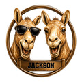 Custom camel metal sign featuring two smiling camels, one wearing sunglasses, inside a circular frame