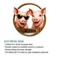 Pig metal sign product presentation showing two playful pigs and a cut metal sign design