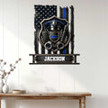 Police badge wall sign displayed on a white paneled wall above a console table