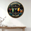 Cocktail bar wall sign displayed on a light paneled wall above a console table
