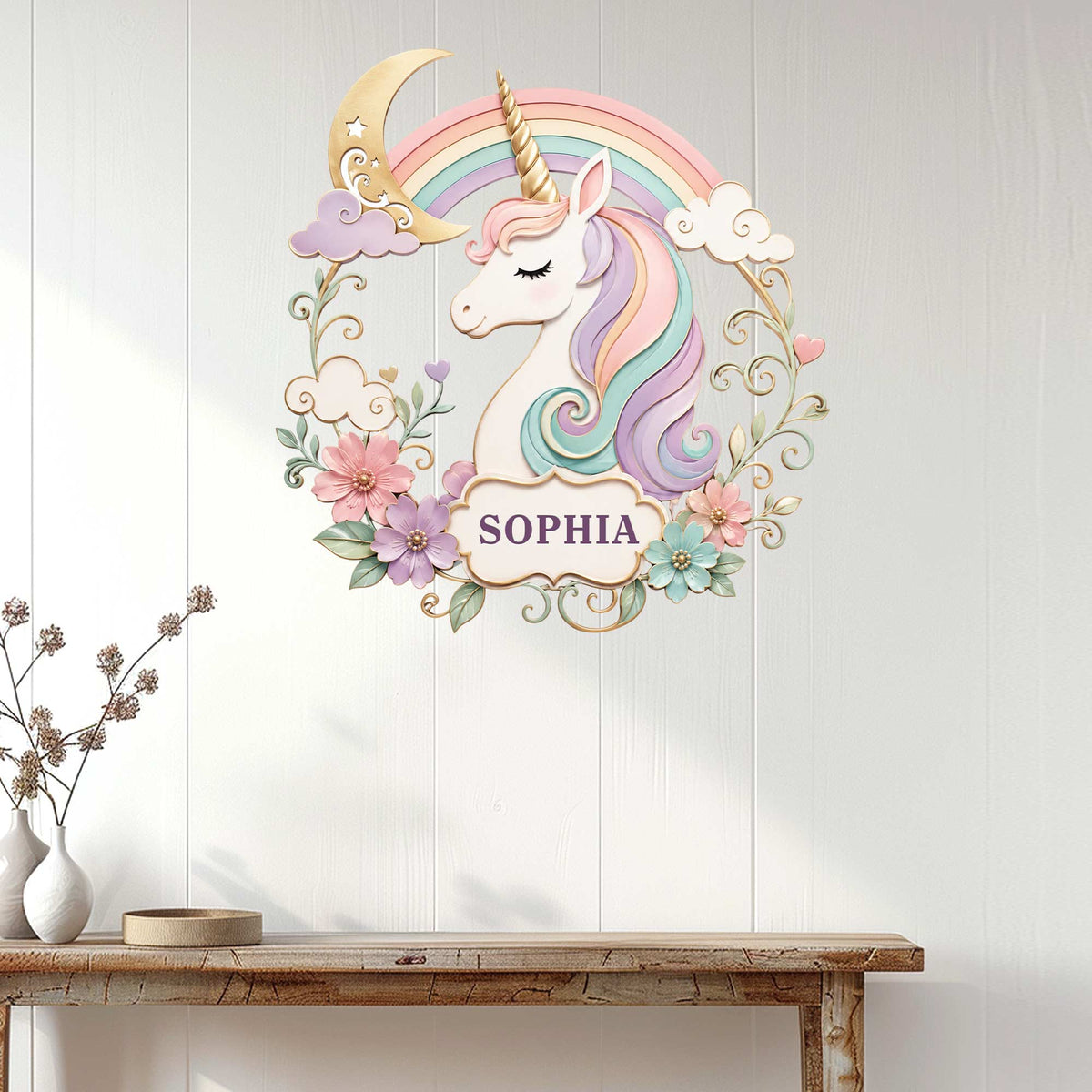 Pastel unicorn metal wall sign displayed above a console table in a bright, neutral room