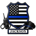 Custom police metal sign featuring a blue line American flag shield, radio, handcuffs, and police cap