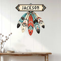 Native American inspired feather metal sign displayed as Southwestern wall decor in a bright home