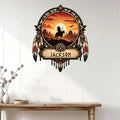 Native American-inspired metal wall sign displayed on white paneling with a horseback rider and desert sunset scene