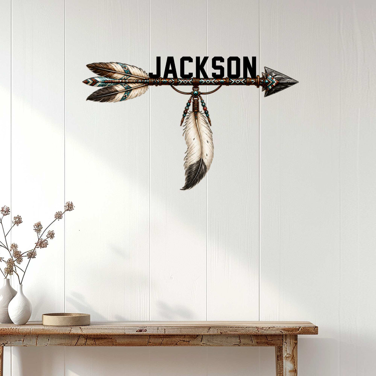 Native American-inspired arrow wall sign displayed above a console table in a bright modern home