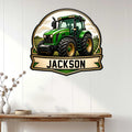 Green tractor metal sign displayed as farmhouse wall decor above a wooden console table