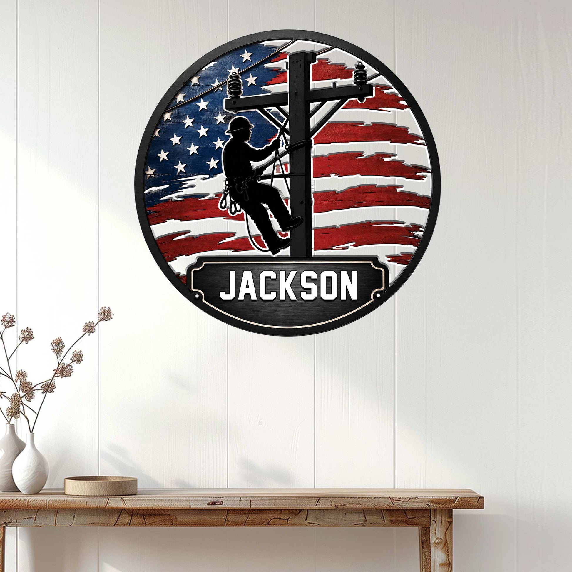 Patriotic lineman wall sign displayed on a white paneled wall in a home decor setting