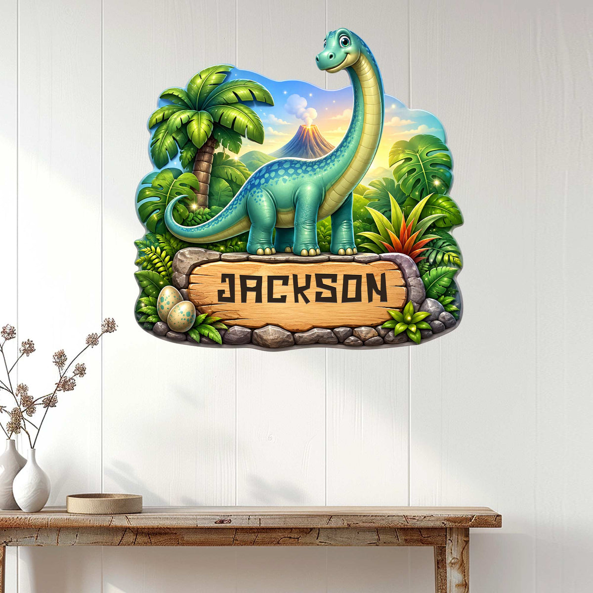 Long-neck dinosaur wall sign displayed as colorful jungle decor on a white paneled wall