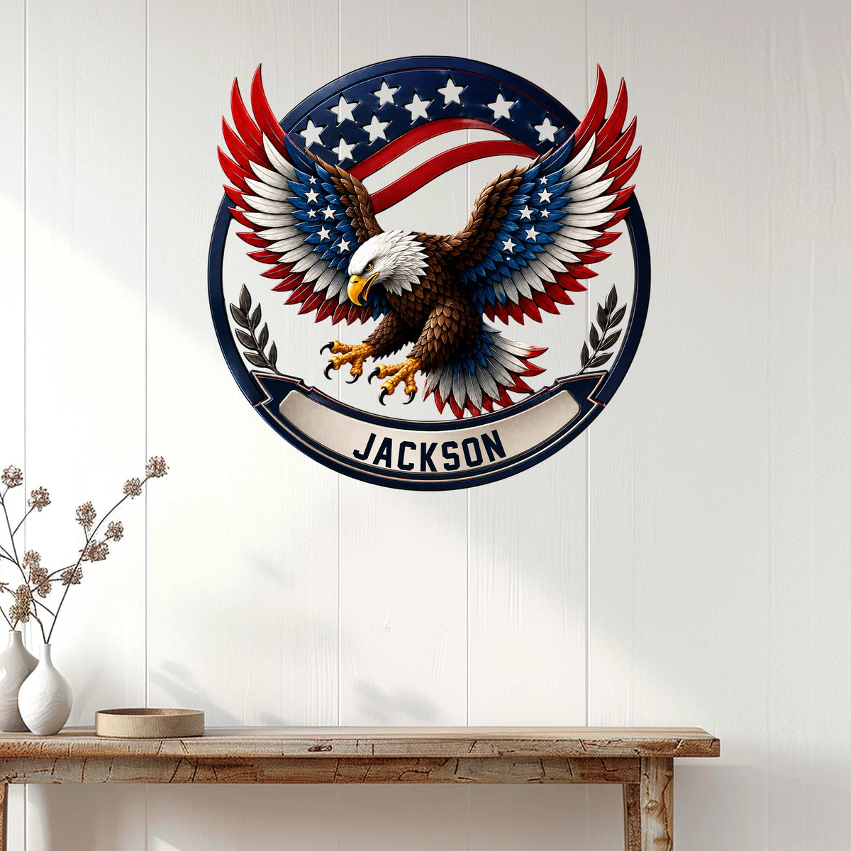 Patriotic eagle metal wall sign displayed on a white wood-paneled wall above a console table