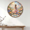 Decorative fairy wall sign displayed above a console table on a bright white paneled wall
