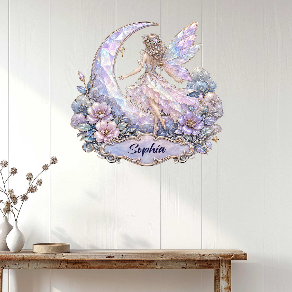 Fairy wall sign displayed on a light wood-paneled wall above a console table