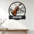 Violin wall decor displayed on a light wood-paneled wall above a console table