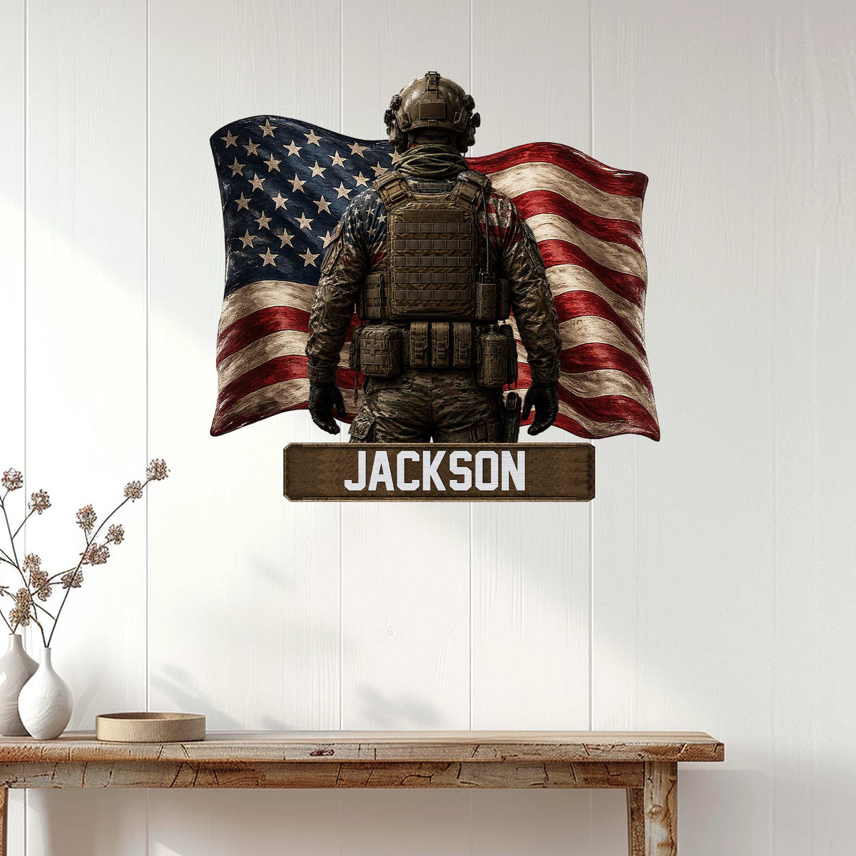 Patriotic military wall sign displayed on a bright paneled wall, featuring a soldier silhouette and American flag