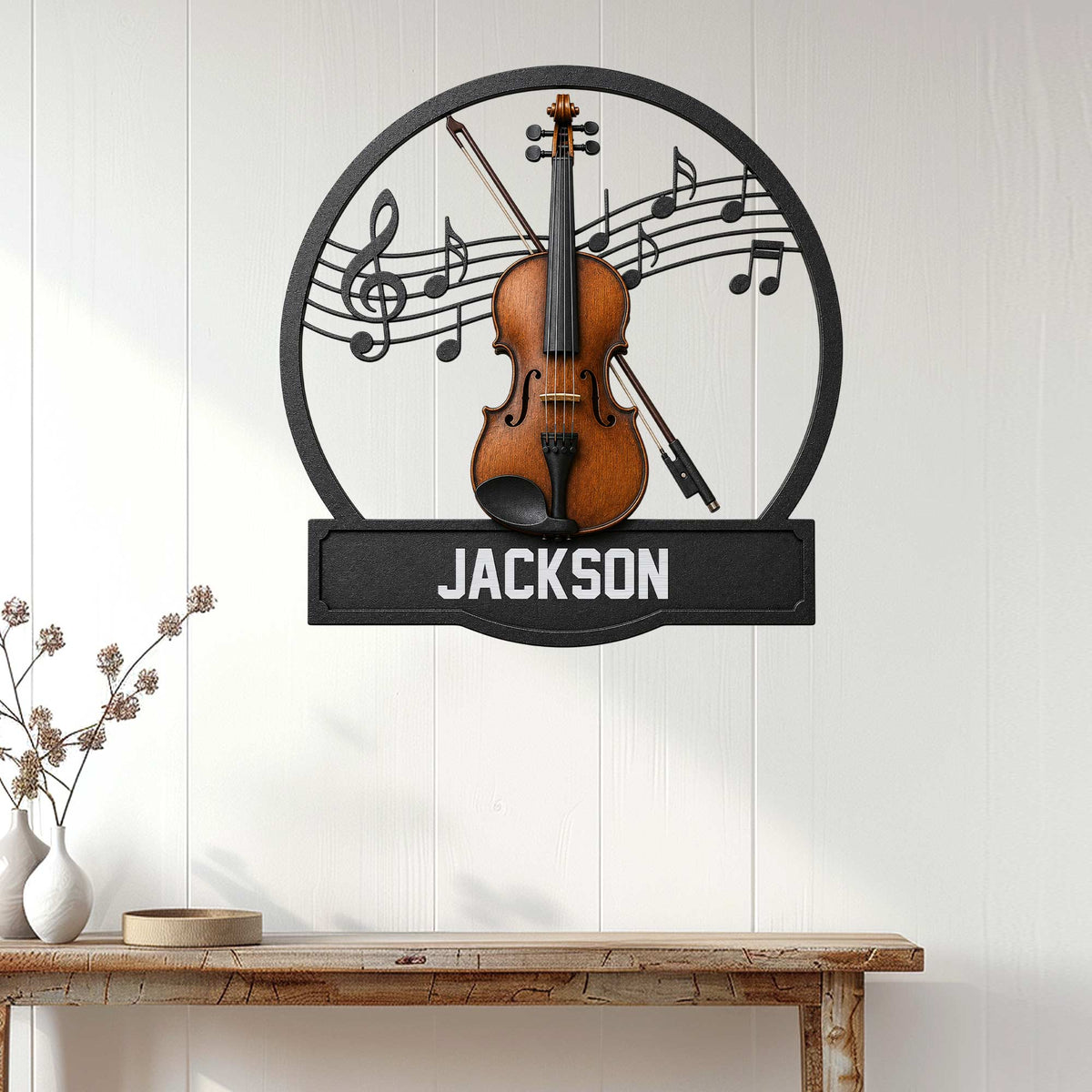 Violin music wall sign displayed on white wood paneling above a console table