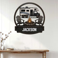RV camping metal wall sign displayed on a light paneled wall above a rustic console table