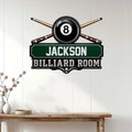 Billiard room wall sign displayed on a white paneled wall above a wood console