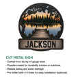 Lake house metal sign with a rustic dock, pine tree shoreline, sunset reflection, and product feature details
