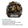 Cut metal construction sign displaying a detailed yellow dump truck and rugged quarry-inspired artwork