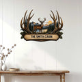 Rustic deer metal sign displayed on a light wood wall, creating a welcoming cabin-inspired focal point.