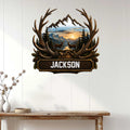 Rustic deer metal wall sign displayed on a white wood-paneled wall above a console table