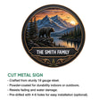 Bear metal sign with a mountain wilderness scene, ornate border, and indoor or outdoor display details