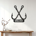 Crossed fishing hook wall sign displayed on a white paneled wall above a console table