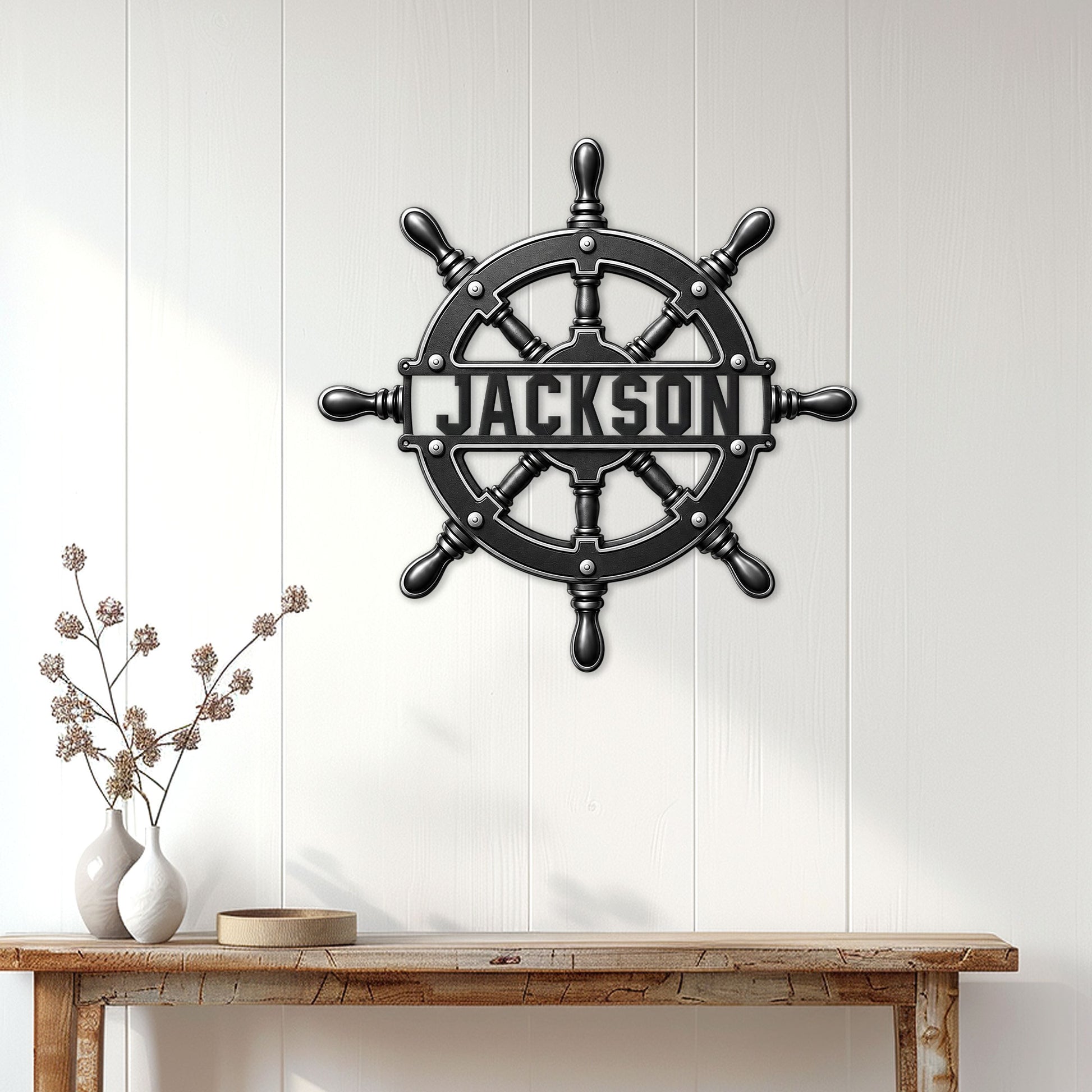 Nautical ship wheel metal sign displayed on a white paneled wall above a console table