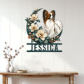 Papillon dog wall sign displayed on a light wood-paneled wall above a console table