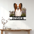 Papillon dog wall sign displayed on a light wood-paneled wall above a console table