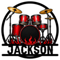 Custom drum metal sign featuring a red drum kit, golden cymbals, black accents, and fiery rock-inspired flames