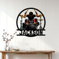 Drummer metal sign displayed on a bright paneled wall above a rustic console table