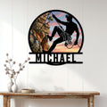 Climber silhouette metal wall sign displayed above a console table in a bright home