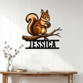 Squirrel metal wall sign displayed on a light paneled wall above a console table