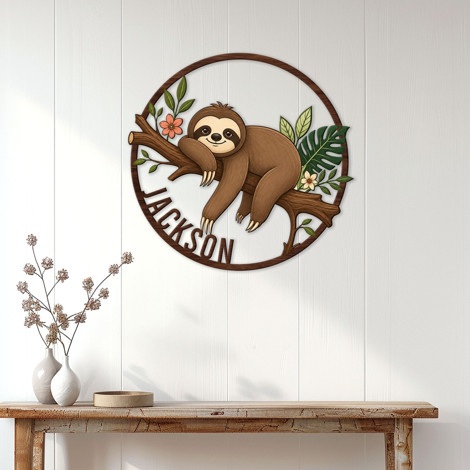 Sloth wall sign displayed on white paneling above a console table in a bright home entryway