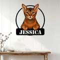 Abyssinian cat wall sign displayed above a console table in a bright modern home