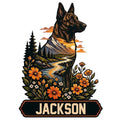 Dutch Shepherd metal sign featuring a detailed dog portrait, mountain river landscape, pine trees, and wildflowers